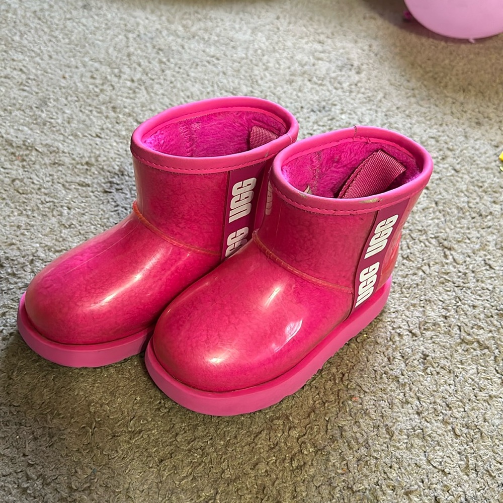 Toddler size 11 UGG’s, pink with white lettering on the side.